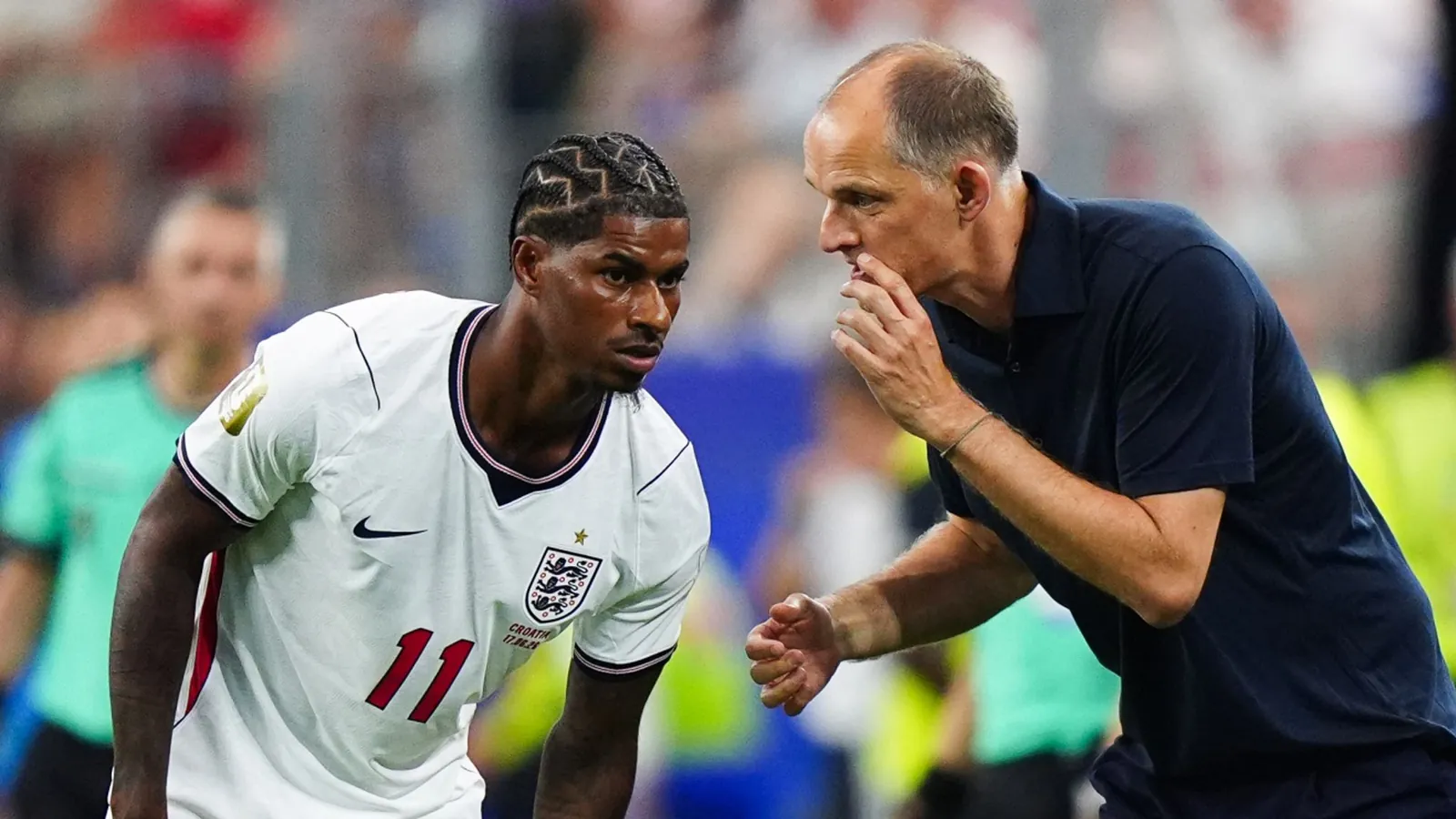 England boss Thomas Tuchel talks to Marcus Rashford during the win over Croatia
